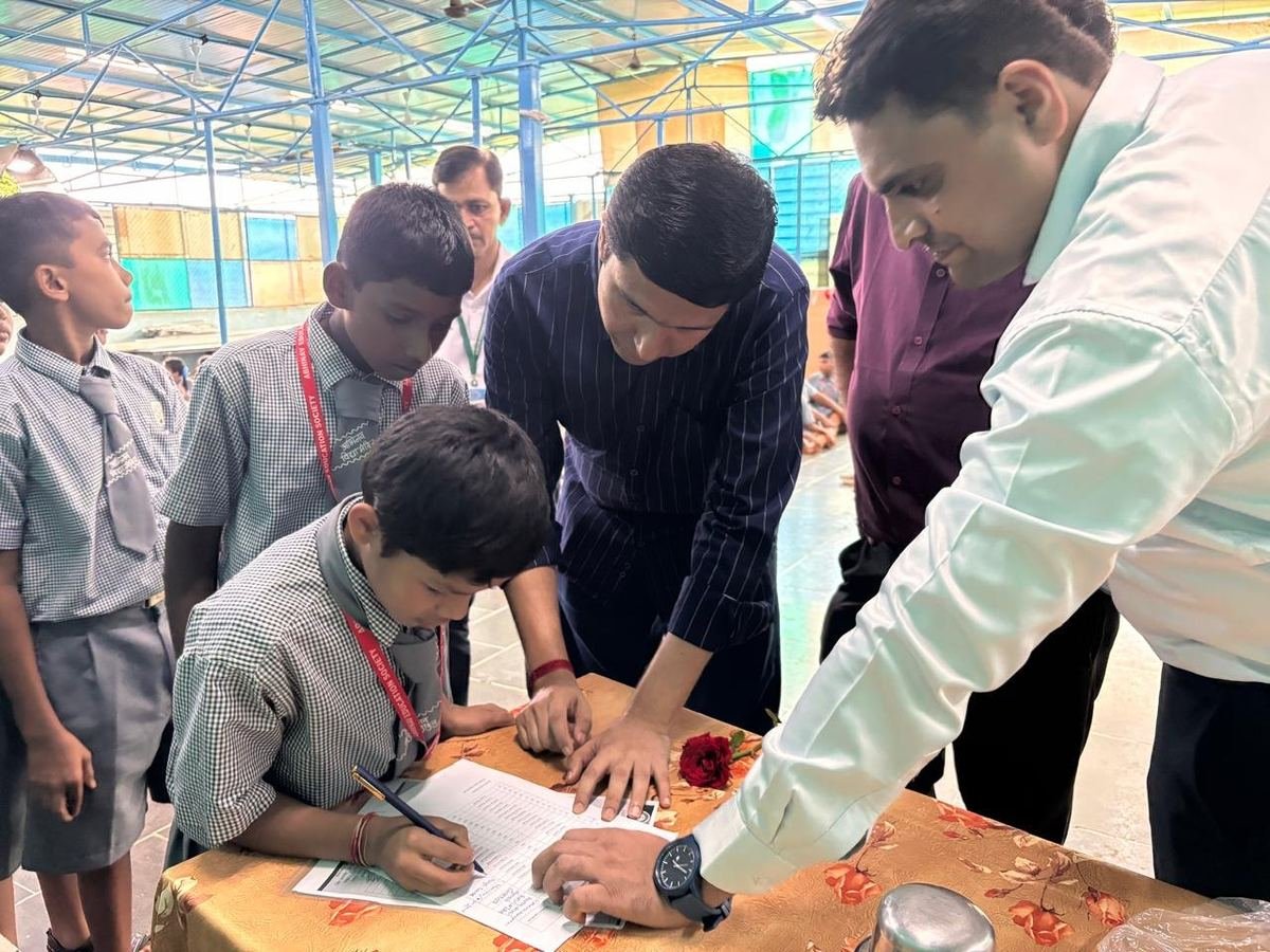 Students signing for their bicycles