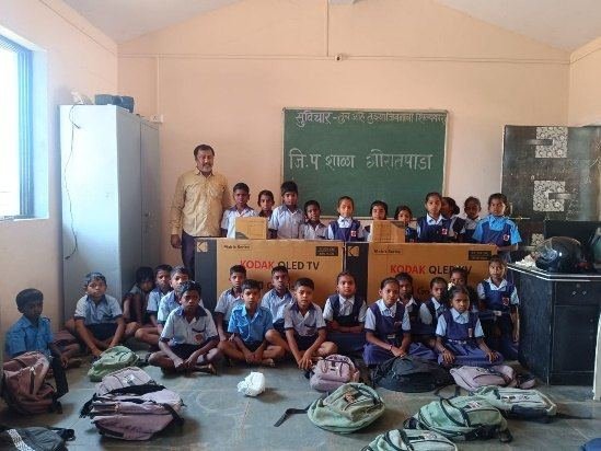 Students with the 2 smart TVs given by SICK India in FY 2023-24