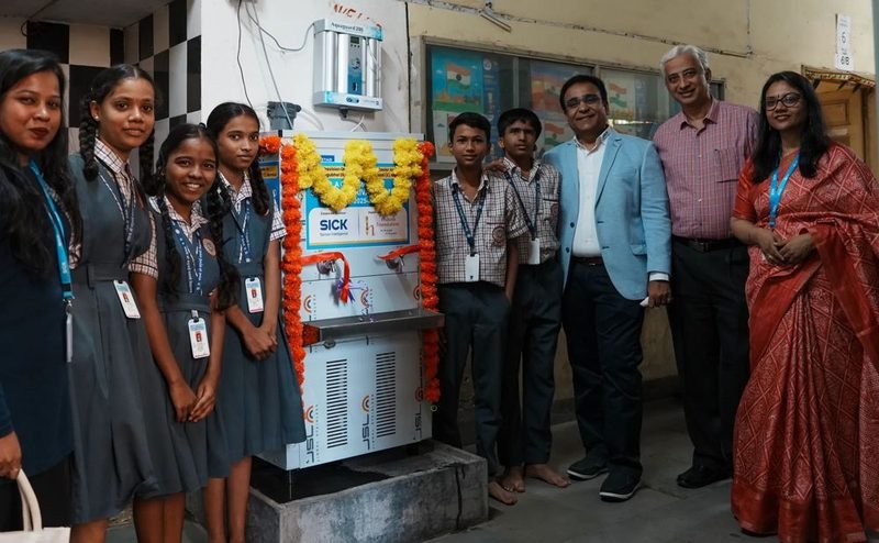 Students and guests at the new water cooler at Shri Mangubhai Dattani Vidyalaya